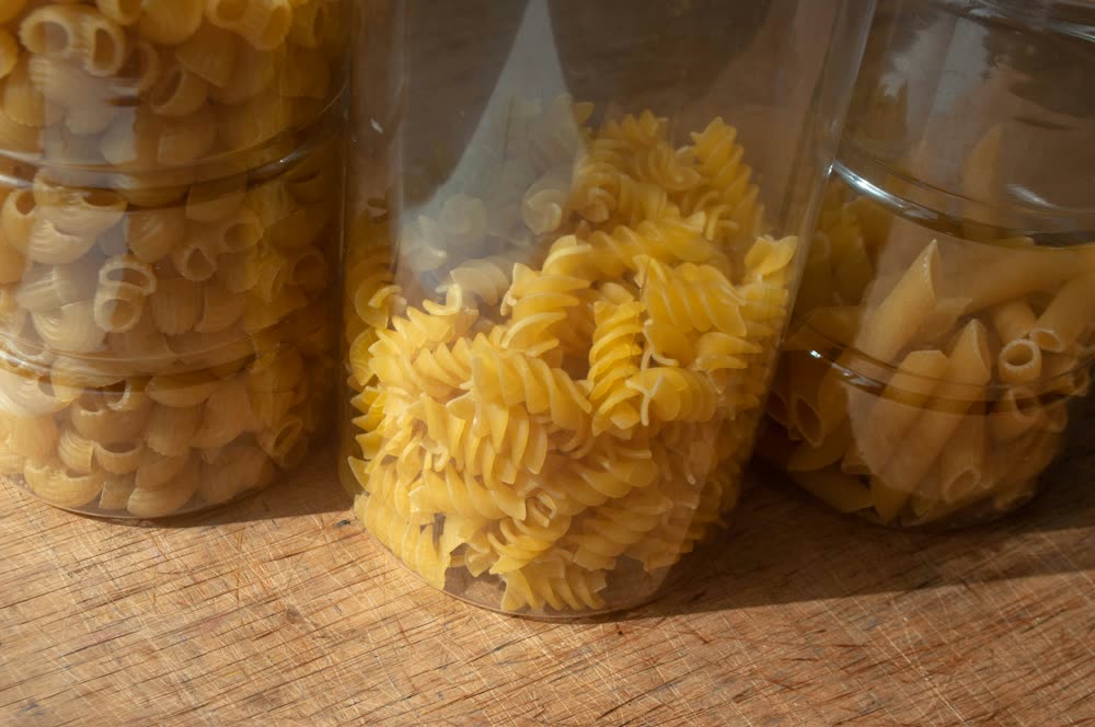 Dry pasta shapes in glass jars
